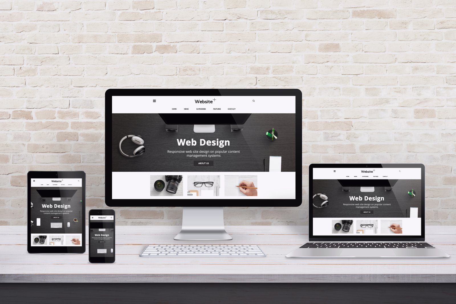 devices with the words web design on their screens